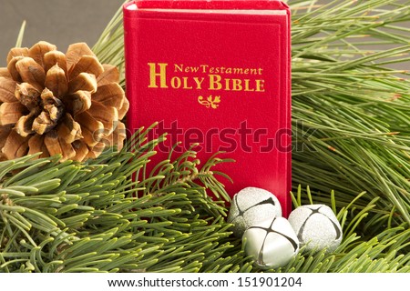 Bible, Pine Cone and Silver Bells Red Bible with pine cone and silver bells, upon blue spruce branches and long needled pine.