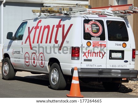 WESTMINSTER, COLORADO/U.S.A. - MARCH 20, 2013: Xfinity Comcast service van parked on the street in front of a customers home. The van has the company logo's on the sides and back.