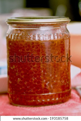 Fresh red caviar of fish in glass jar