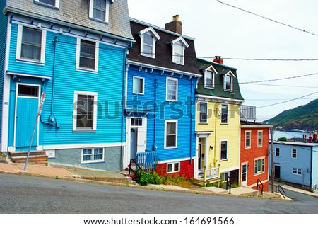 ST. JOHN'S - JULY 25: Distinctive post colonial houses on residential street of St. John's on July 25, 2010 in St. John's, Newfoundland, Canada.