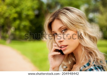Beautiful girl speaks by phone