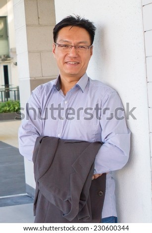 Portrait of a smiling and successful chinese man