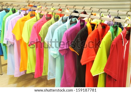 colorful  fashion clothing on hangers at the show