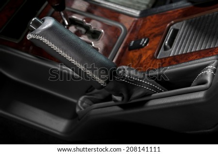 Hand brake in car. Auto interior detail.