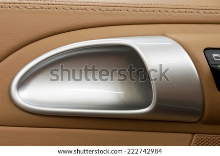 Auto door handle.  Car interior detail.