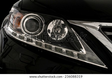 Auto headlights. Car exterior detail.