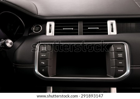 Modern car dashboard. Multimedia screen. Interior detail.