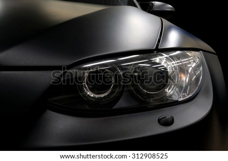 Black car headlights. Exterior detail.