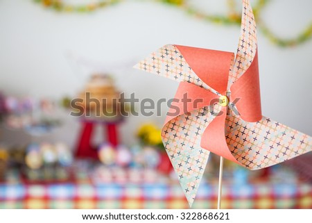Pinwheel toy with party scene behind