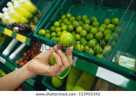 Holding Lemon at Super Market