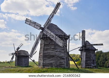 Old wooden windmills on background of blue sky, Kyiv region, Ukraine/Wooden windmills/Old wooden windmills on background of blue sky