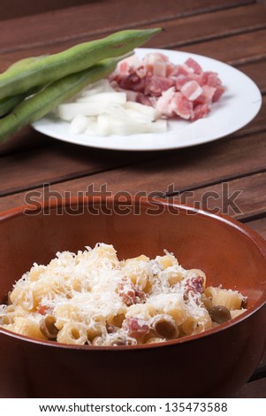 traditional Italian dish of pasta bacon broad beans and sheep\'s cheese