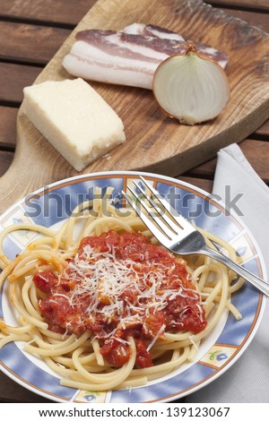 Bucatini matricini Dish of the Roman cuisine, pasta bacon onion tomato sauce and pecorino cheese