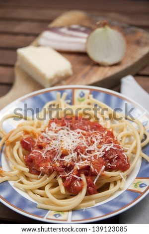 Bucatini matricini Dish of the Roman cuisine, pasta bacon onion tomato sauce and pecorino cheese