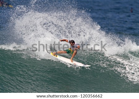 HAWAII - NOVEMBER 24: Brazil\'s Alejo Muniz takes fourth place at the Reef Hawaiian pro, stage one of the Vans Triple Crown of Surfing November 24, 2012 at Haleiwa Beach Park.