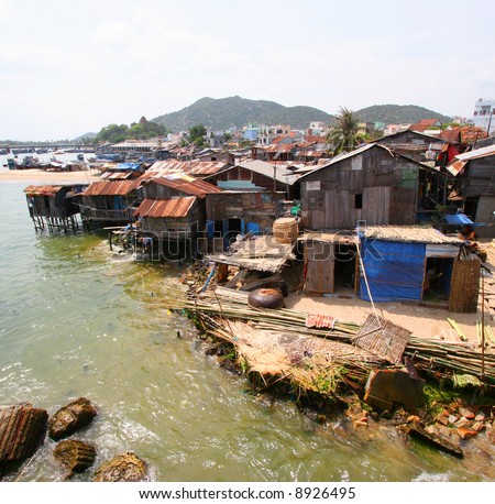 poor housing along river bank in Vietnam