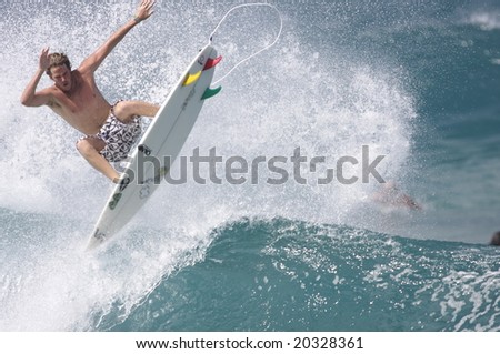 Hawaii - Nov. 7: Casey Brown is an active competitor on the World Qualifying Series of professional surfing, here he performs a difficult aerial maneuver at Rocky Point, Nov. 7, 2008 in Hawaii.