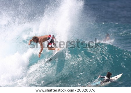 Hawaii - Nov. 8: Granger Larson is one of Maui\'s rising young surf stars and is an active competitor of the Triple Crown of Surfing, here he performs a backside maneuver Nov. 8, 2008 in Hawaii.