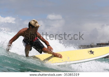 HAWAII - JULY 23: A competitor practices for China\'s Annual Longboard contest July 23, 2009 at Waikiki, Hawaii.