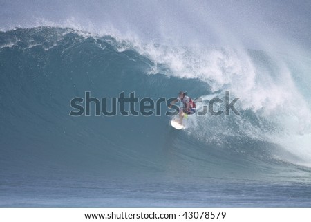 HAWAII - DECEMBER 12: Australia\'s Taj Burrow surfs his way to victory at the Billabong Pipemasters Dec. 12, 2009 in Hawaii. This is the third event in the Triple Crown of Surfing.