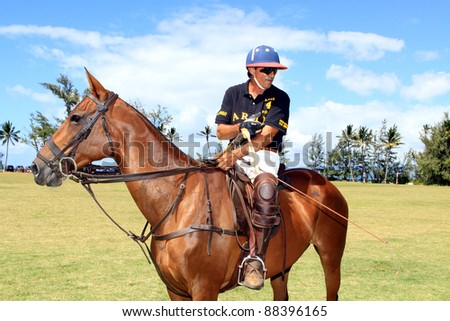 MOKULEIA, HAWAII - JULY 4: Mark Becker takes a break during a polo match on Independence Day on July 4, 2011 in Mokuleia, Hawaii.