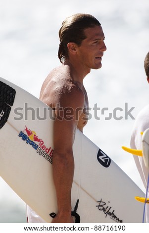 OAHU, HI - CIRCA 2005: Three time world champion surfer, Andy Irons, surfs at Off The Wall circa 2005 in Oahu, Hawaii. Andy Irons passed away unexpectedly on November 2, 2010.