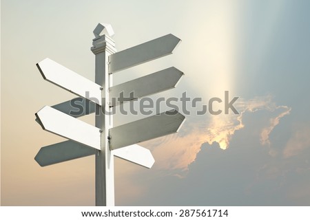 direction sign with blank spaces for text on beautiful sunbeam background