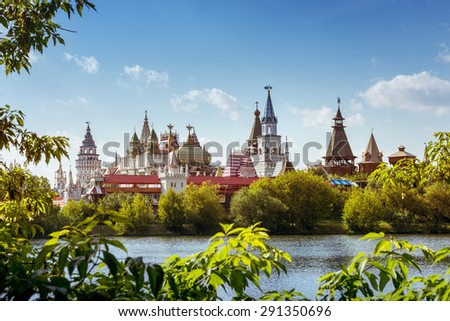 Beautiful russian landscape of Izmailovsky kremlin with pond framed by trees. Moscow city, Russia. Summer photo