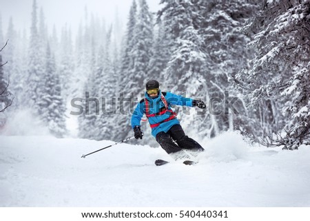 Skier moving very fast in forest. Off-piste slope in Sheregesh ski resort