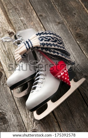The white ice skates on old wooden boards