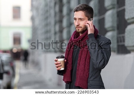 man talking on the phone outdoors