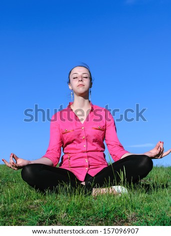 Beautiful women doing meditation in the open air