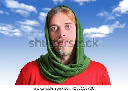 the look of a man with his head covered up at the sky, hoping to see something