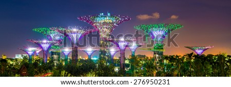 SINGAPORE - APRIL 06: Futuristic view of amazing illumination at Garden by the Bay on April 6, 2013 in Singapore. Night light show at Supertree is main Marina Bay Sands district tourist attraction