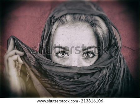 Mysterious Portrait of Young Pretty Blonde Woman Covering her Eyes with a Veil