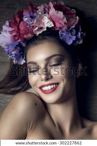Attractive Young Happy Smiling Brunette with Floral Garland