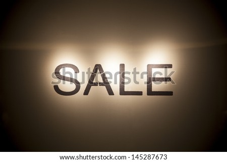 Shop Window With Sale Sign at night