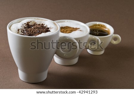 Kafi "MAJEVICA" - Page 2 Stock-photo-three-coffee-cups-with-espresso-cappuccino-mochachino-over-brown-background-42941293