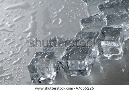 Wet ice cubes objects over water surface