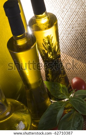 Olive oil bottle still-life over  textured background with back light