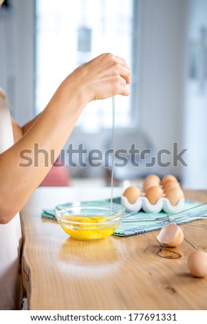 Woman prepeared eggs for cooking