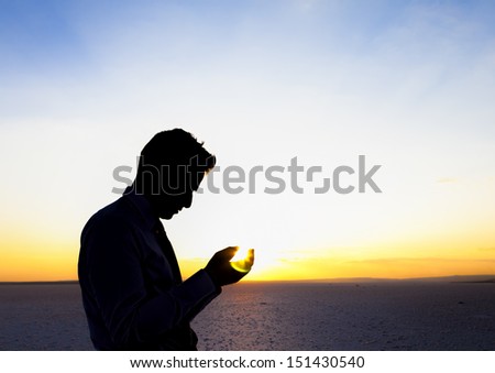 Praying at sunset Praying at sunset