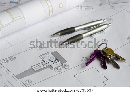 Building plan, keys and pens