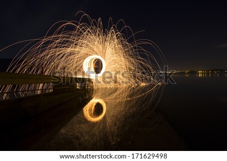 Reflections from spinning steel wool on a slip way in County Down.