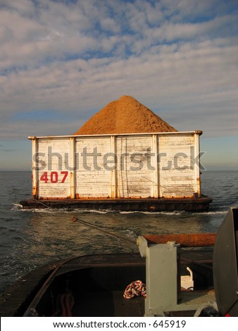 Barge carrying wood chips