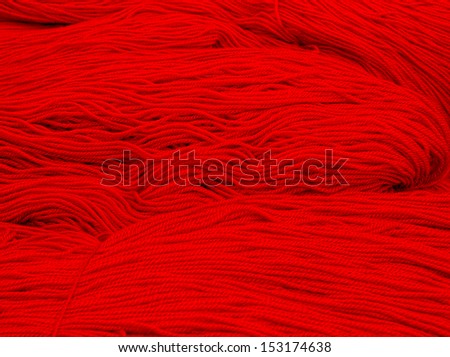 loose skeins of bright fire red wool