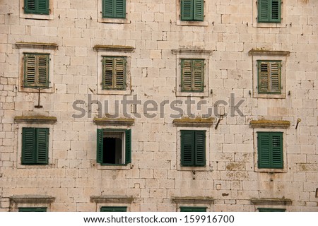 A facade of Croatian building with the only opened window