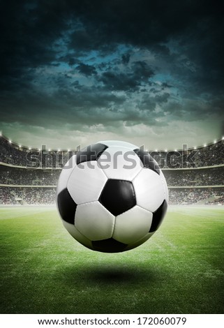 Soccer Ball On The Field Of Stadium With Light