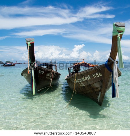 KRABI - MAY 4, 2013 : The boats are alongside the beach before let the travelers tour around Andaman Sea at \