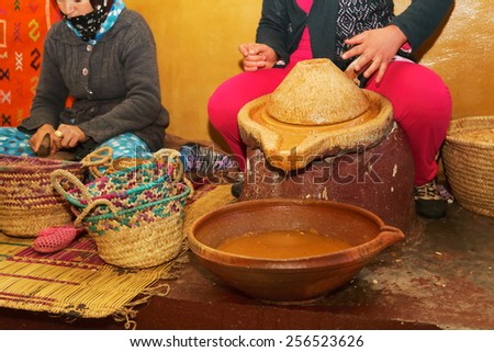 argan oil processing by hand by women used in cosmetics and food morocco